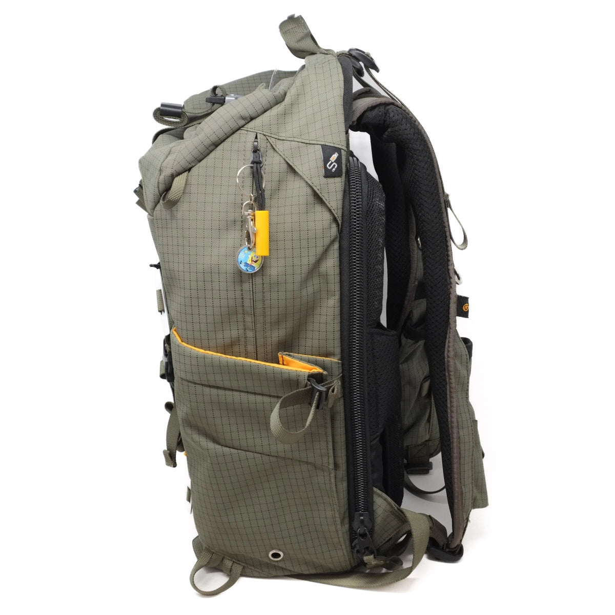 Green backpack with multiple compartments and a visible brand logo on a white background