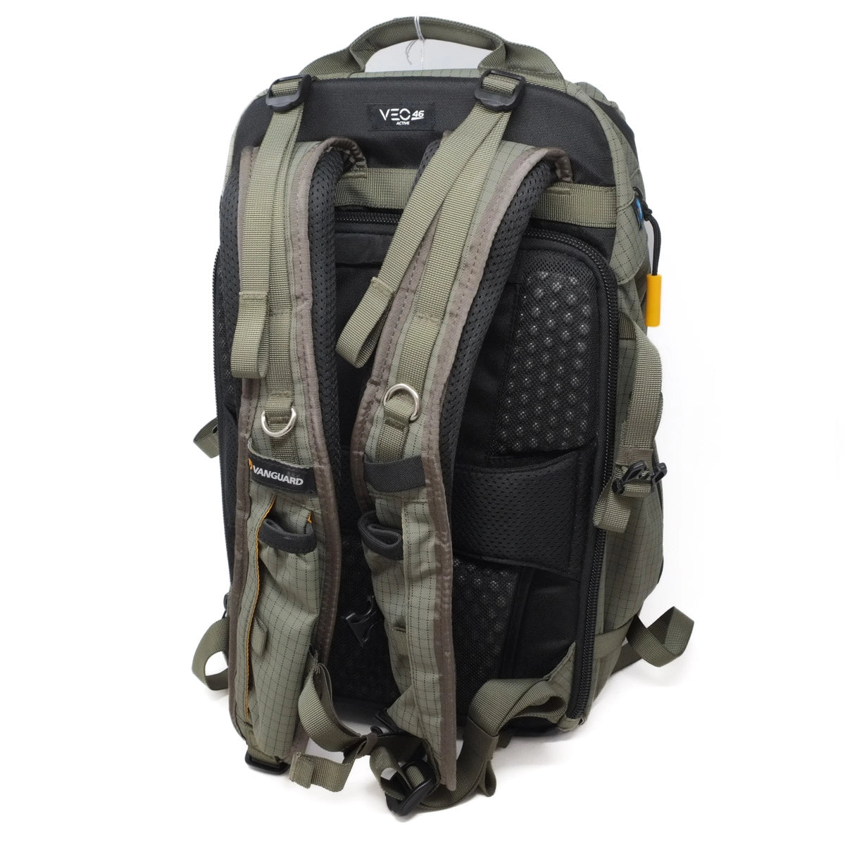 Green and black backpack with multiple compartments on a white background