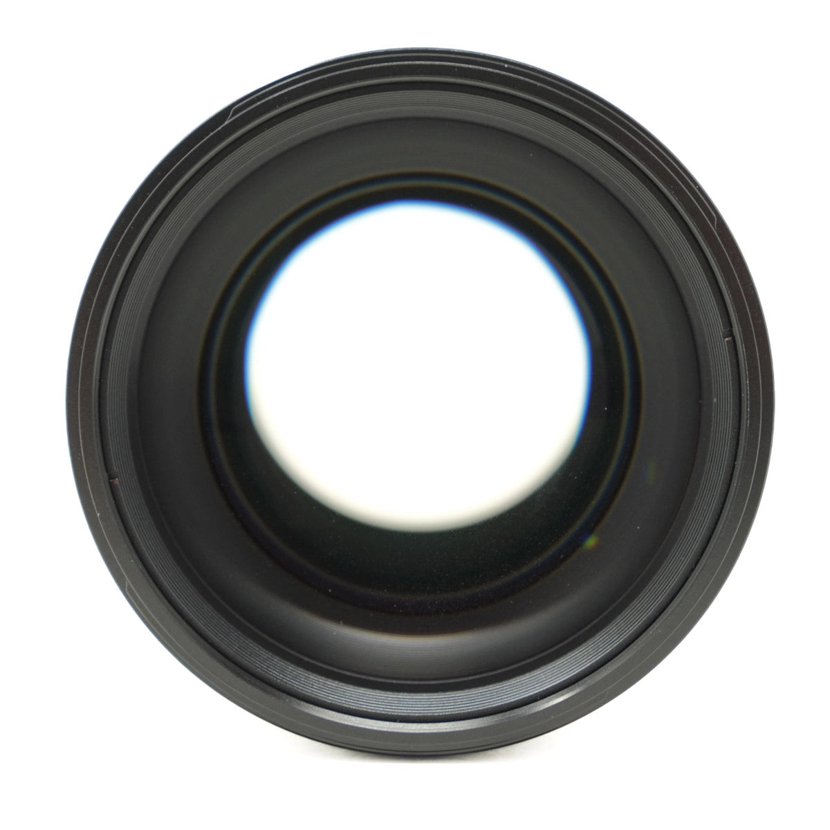 Black camera lens on a white background
