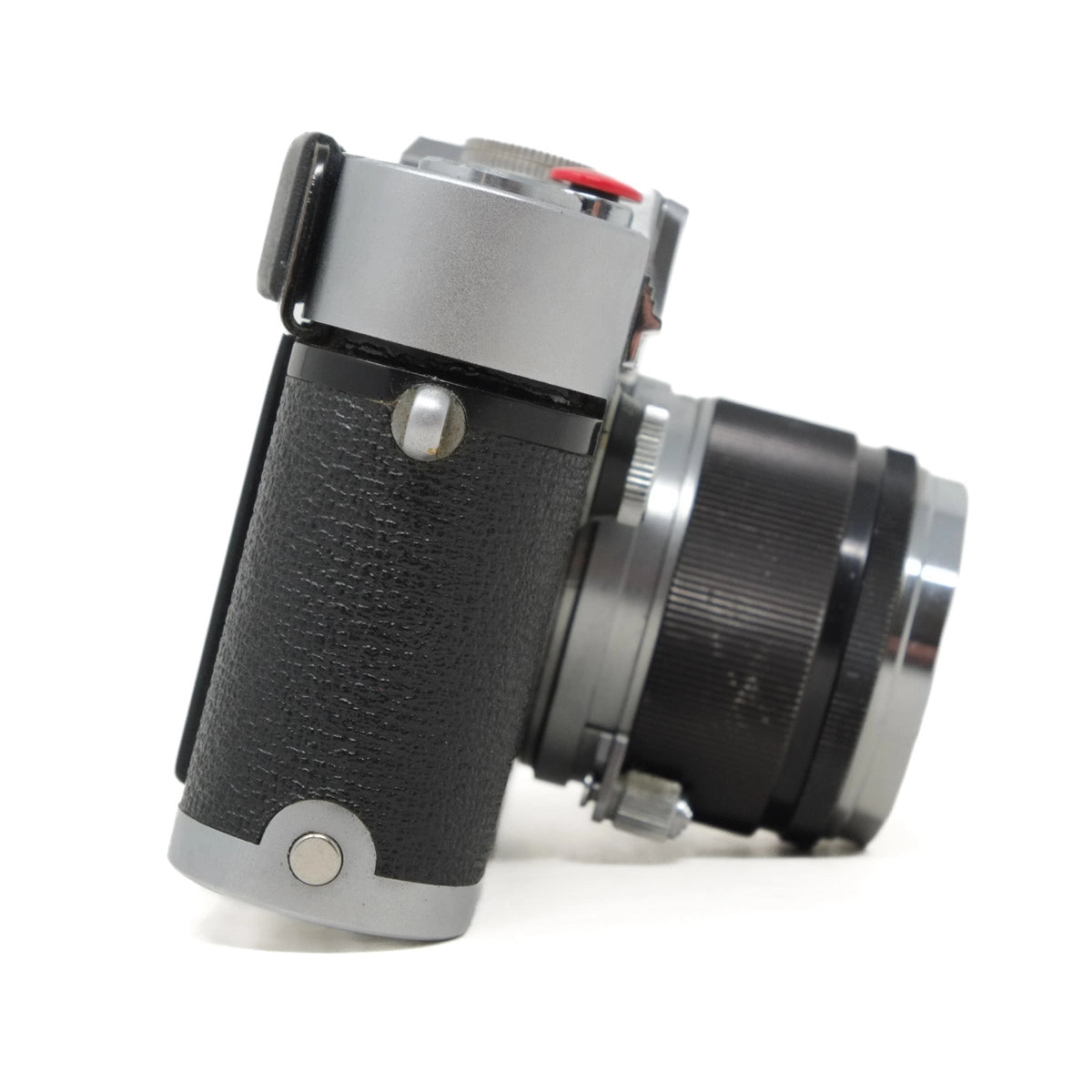 Close-up of a vintage camera on a white background