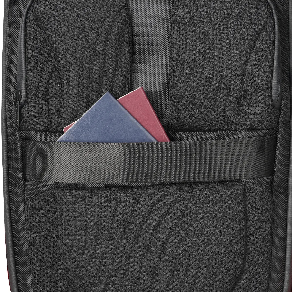 Black backpack with a front pocket holding two colorful books.