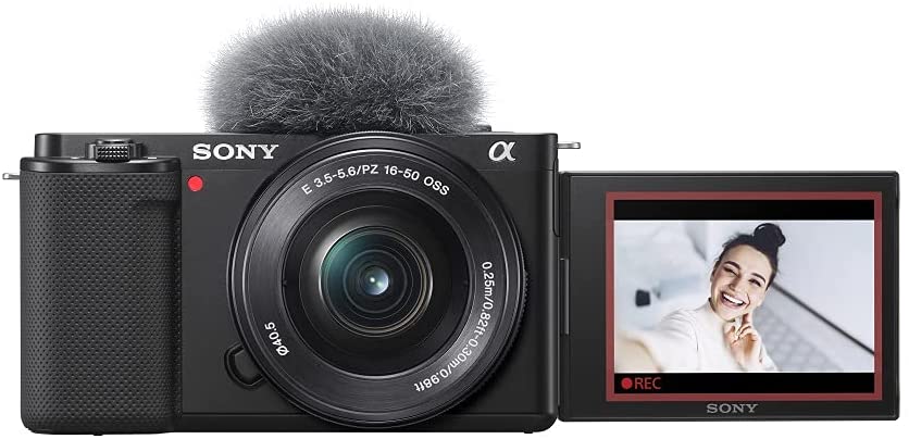 Sony Alpha ZV-E10 APS-C vlog camera with 16-50mm lens - Product Photo 1 - Front view of the camera with the screen extended and microphone buff attached